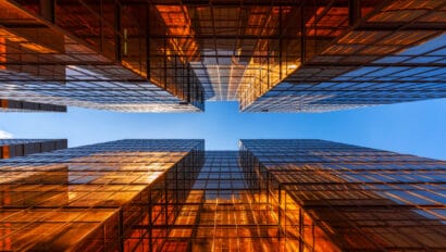 golden-building-with-blue-sky-windows-glass-of-modern-office-skyscrapers-facade-design-architecture-exterior-for-cityscape-background