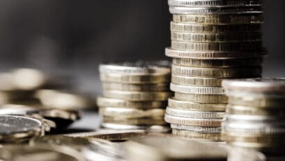 lots-of-coins-the-concept-of-investing-or-saving-money-or-a-financial-crisis-copy-space